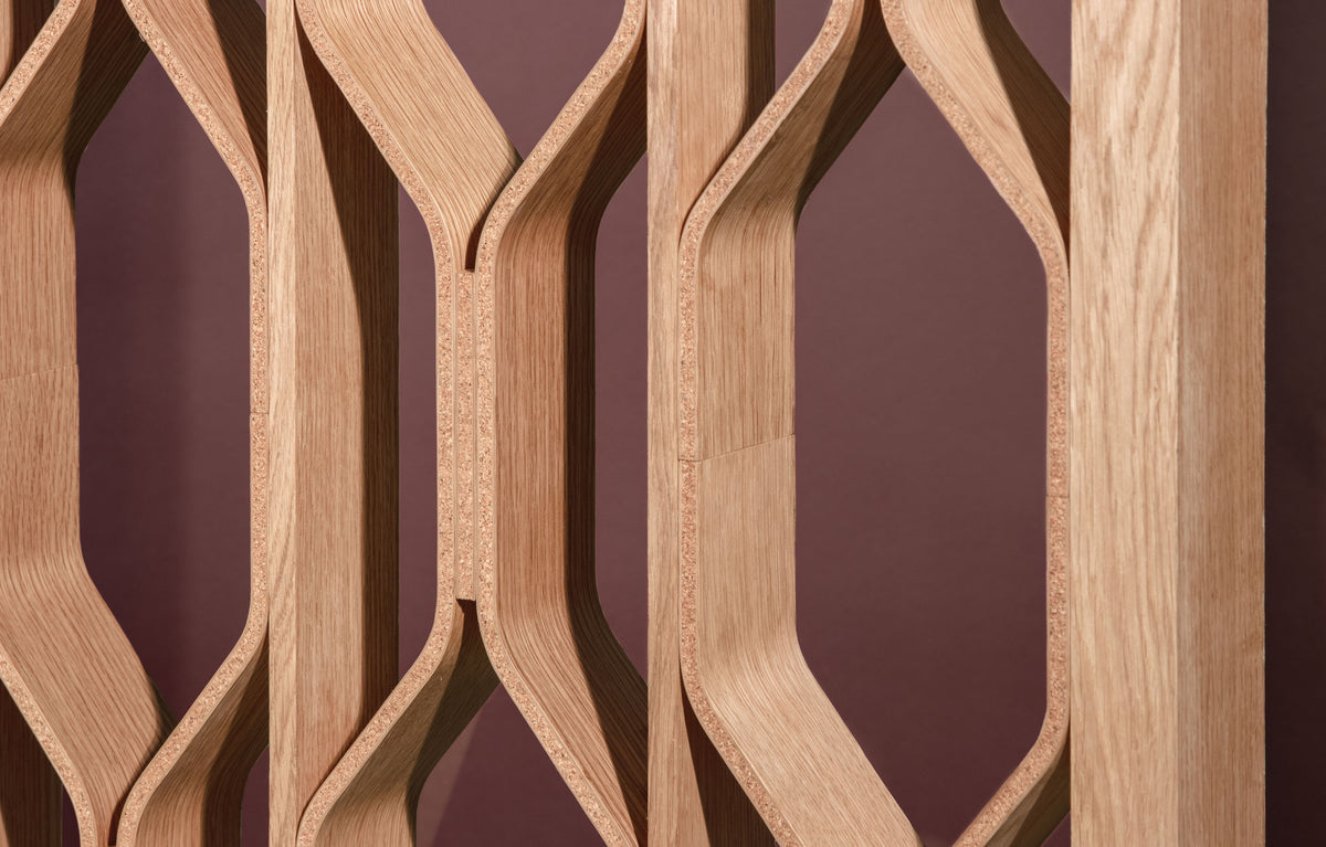 Wooden lattice panel with a geometric pattern ona mauve background