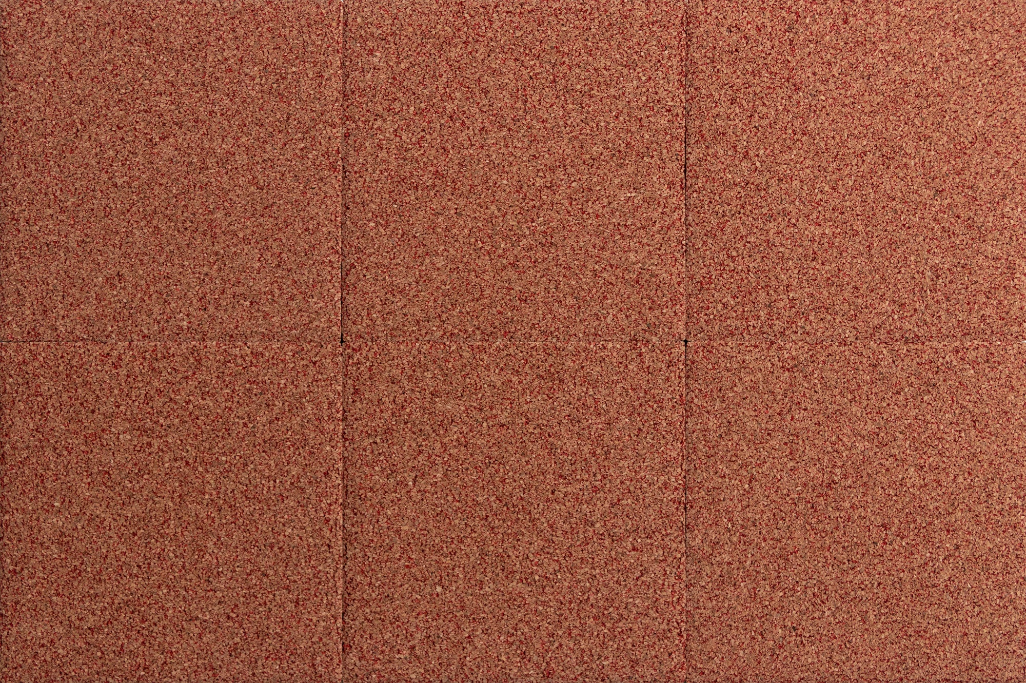 Six tiles of tan and red cork