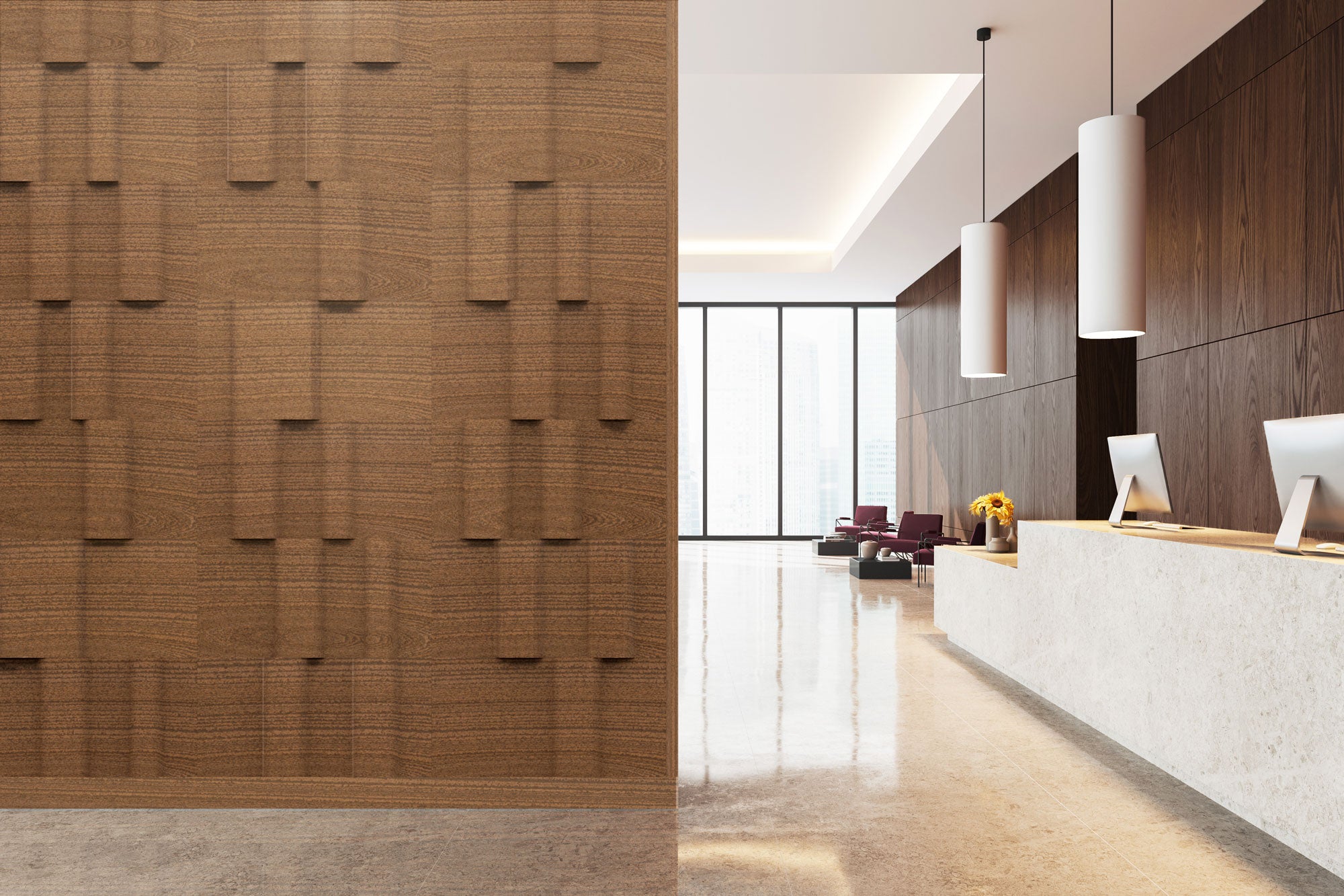 lobby of an office building with large windows in the background, a walnut wood wall in the foreground and a reception desk at right
