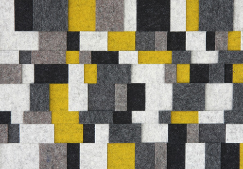 Closeup of felt squares in white, gray, yellow, and black
