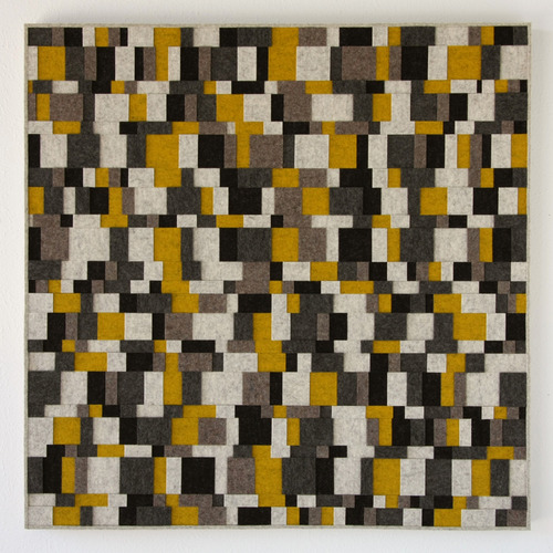 Square felt wall panel with square and rectangle felt pieces in white, gray, yellow, and black.
