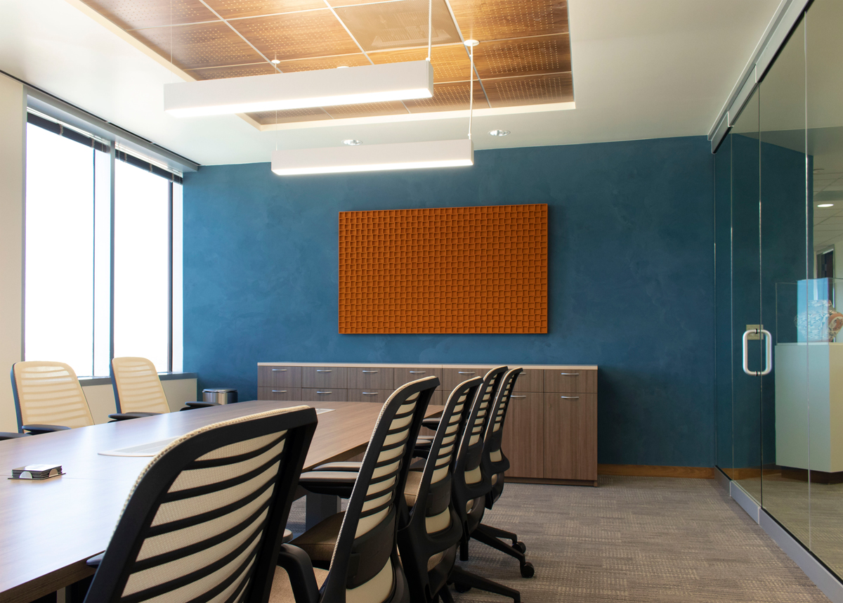Orange Odessa Wall panel installed on a blue wall in a conference room