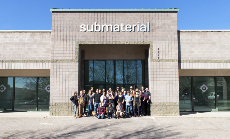 Submaterial staff infront of the building