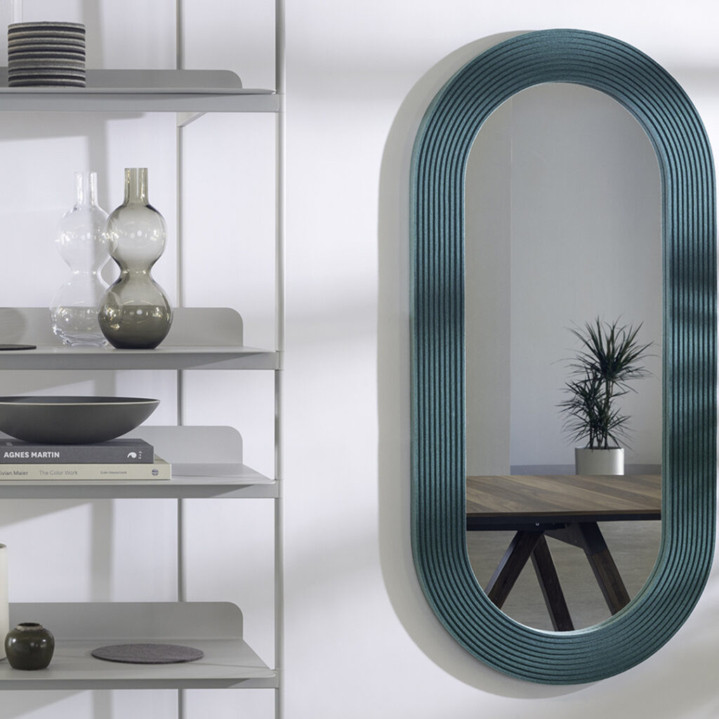 capsule oval mirror with green ribbed felt edging