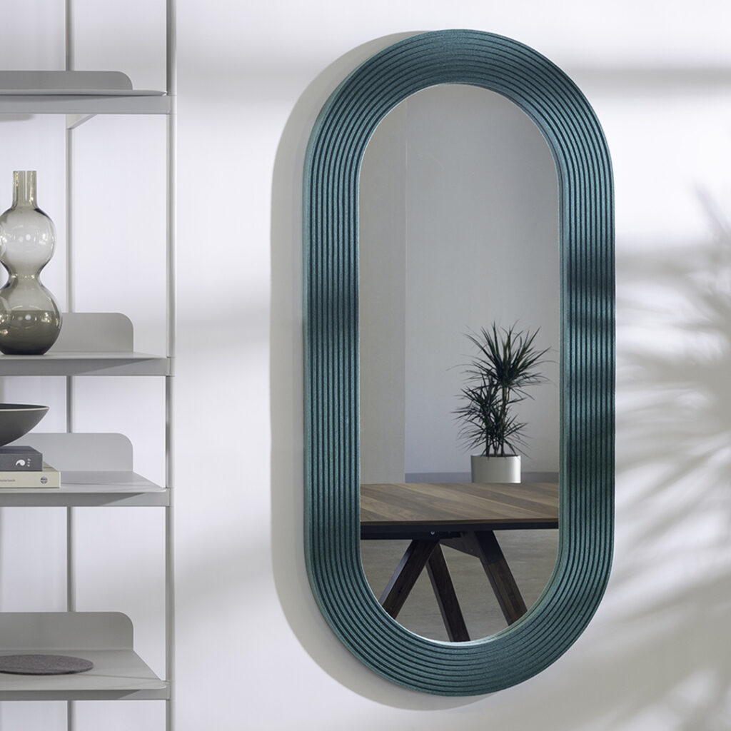 capsule oval mirror with green ribbed felt edging