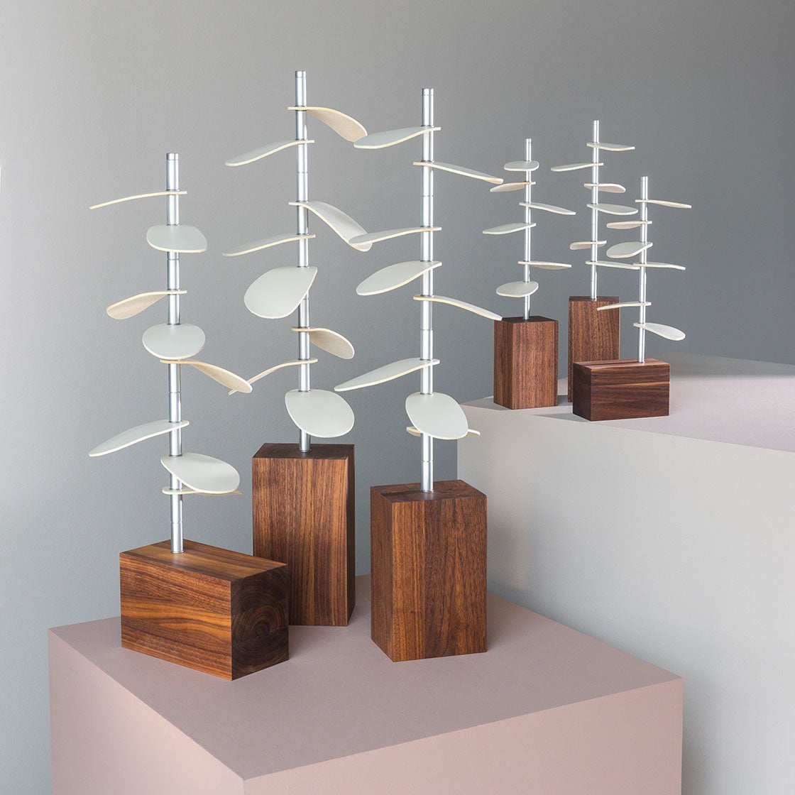 murmur trees are sculptural objects made of walnut and leather