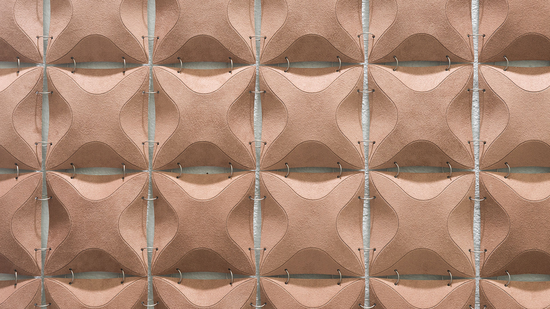 Submaterial construct finite wall hanging made from knoll ultrasuede in a dusty rose color