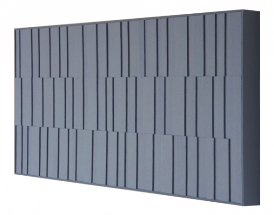 A wall panel with different height rectangular pieces in gray.