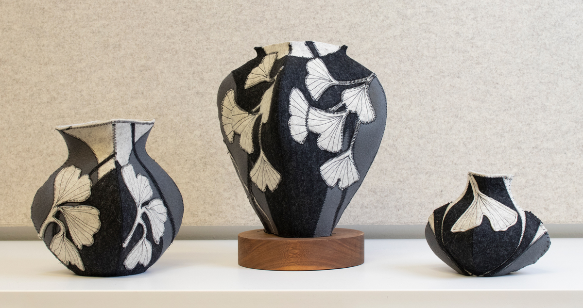 Trio of black, gray, and white felt vessels with gingko leaf pattern by artist Molly Zimmer