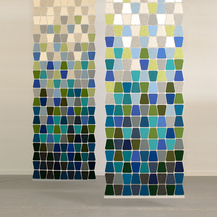 Two felt screens with alternating rounded trapezoid shapes in a gradient from white and gray to greens and blues