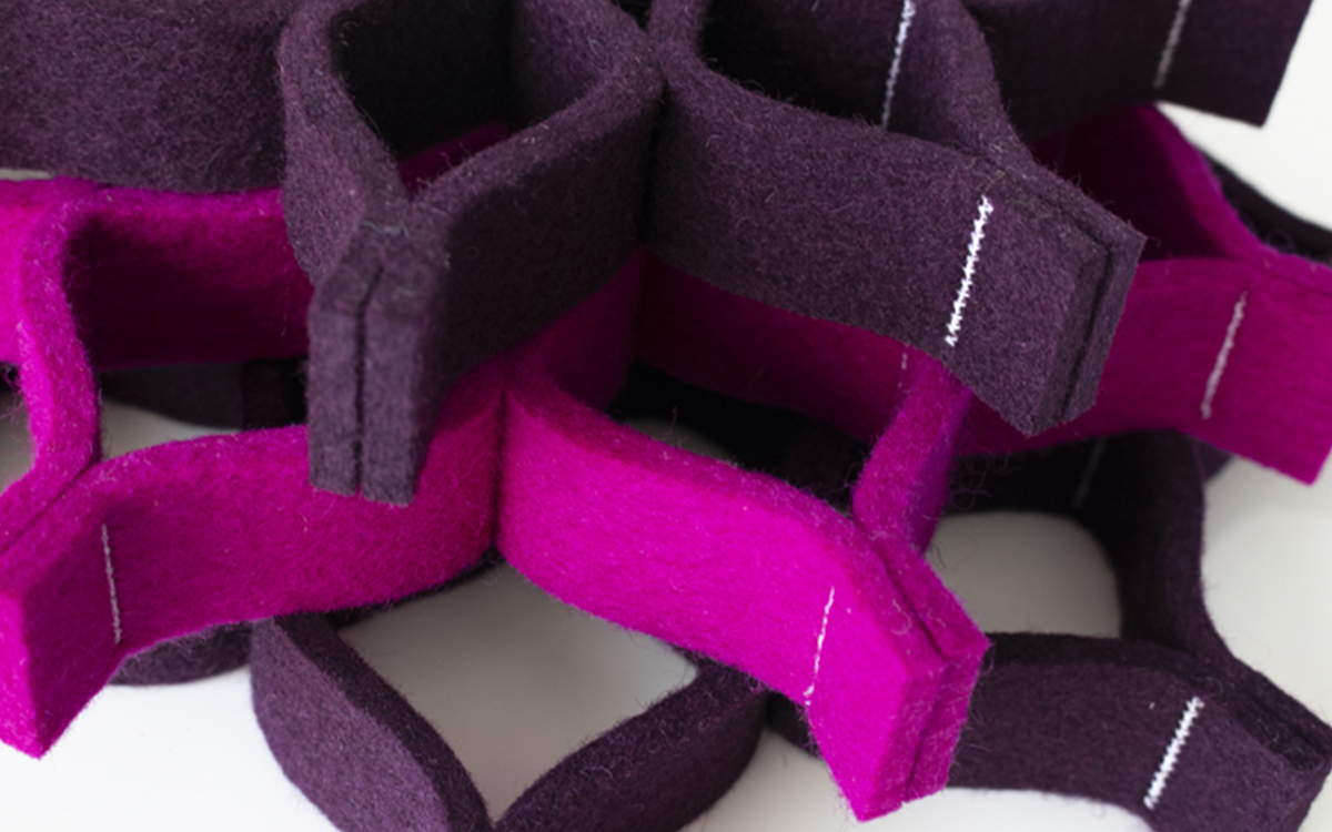 Purple and pink felt trivets piled on top of each other