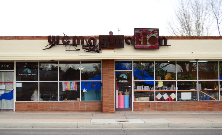 A colorful storefront with the name Wemagination above the door.