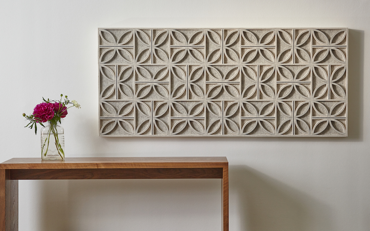 White leather wall panel with built-up surface of concentric rectangles in vegetable-tanned cowhide.