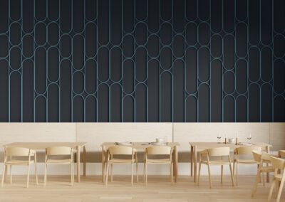 A two-tone blue felt wall installation in a restaurant. The felt wall is broken up into pill shapes of various lengths